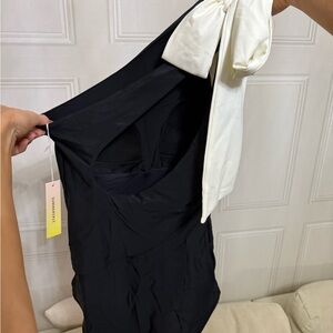 Black one piece swimsuit with a bow